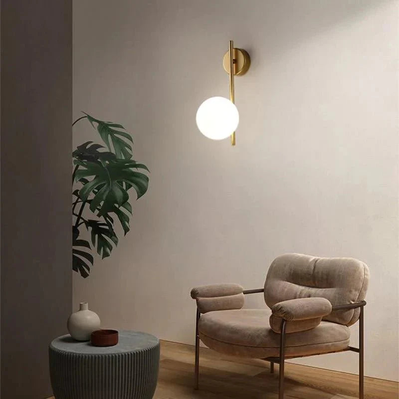 Australum LUNA minimalist globe sconce on neutral wall